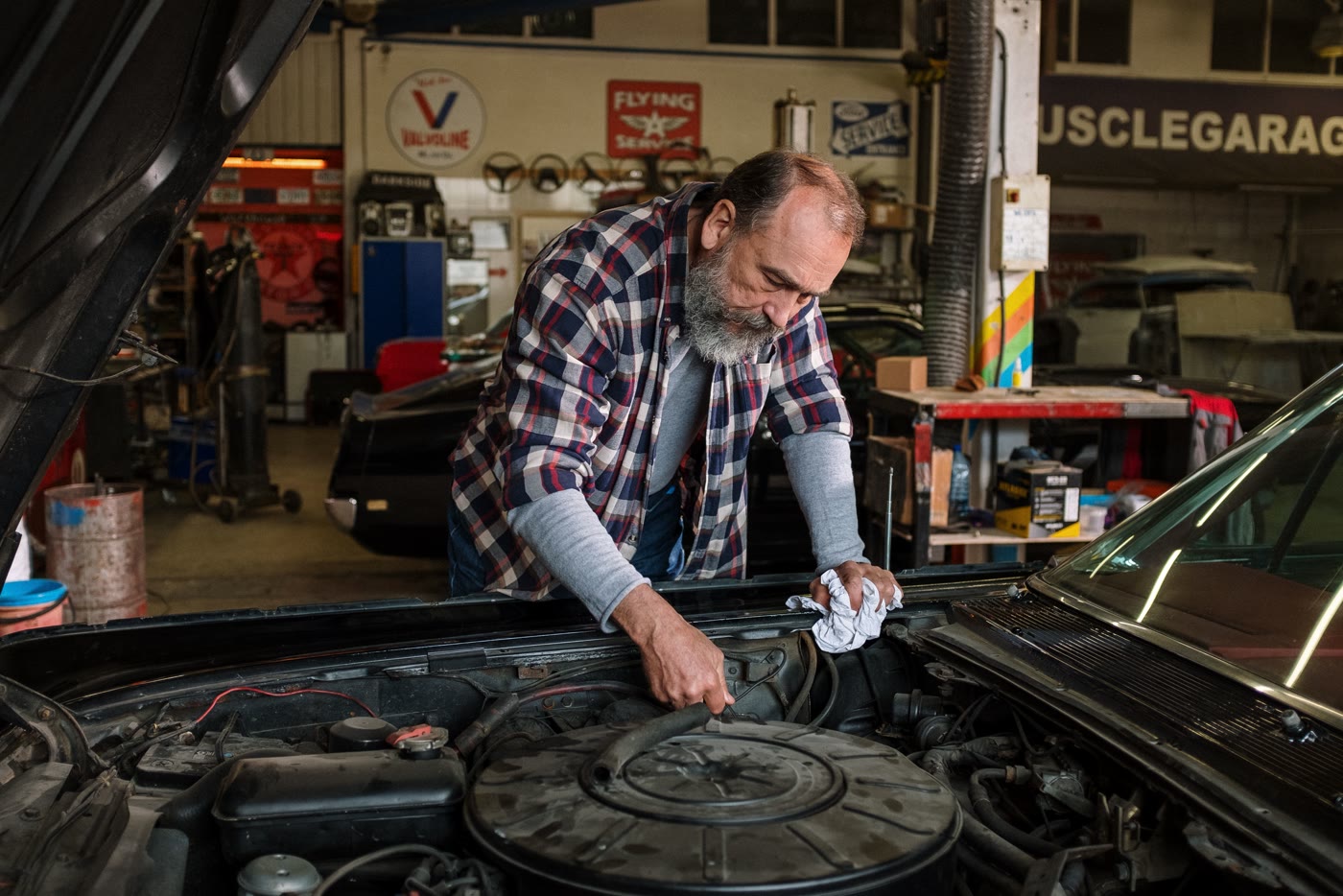 Going over the engine bay of a classic before it is listed